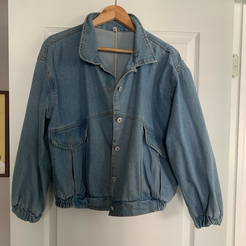 Vintage denim jackets with patches on back.